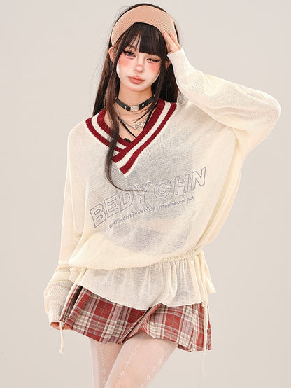 Aprikosenfarbenes, halbtransparentes, lockeres Strickoberteil mit V-Ausschnitt und gerüschter Taille