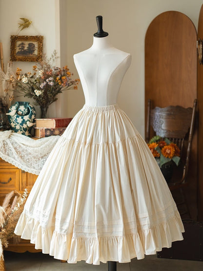 クリーム色のコットン裾スカート フラウンスウエスト ホワイトアンダーゴム