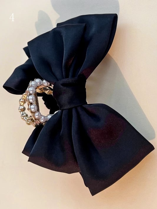 ビーズの蝶結びの黒い爪クリップ装飾