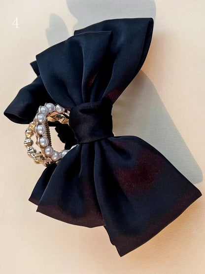 ビーズの蝶結びの黒い爪クリップ装飾