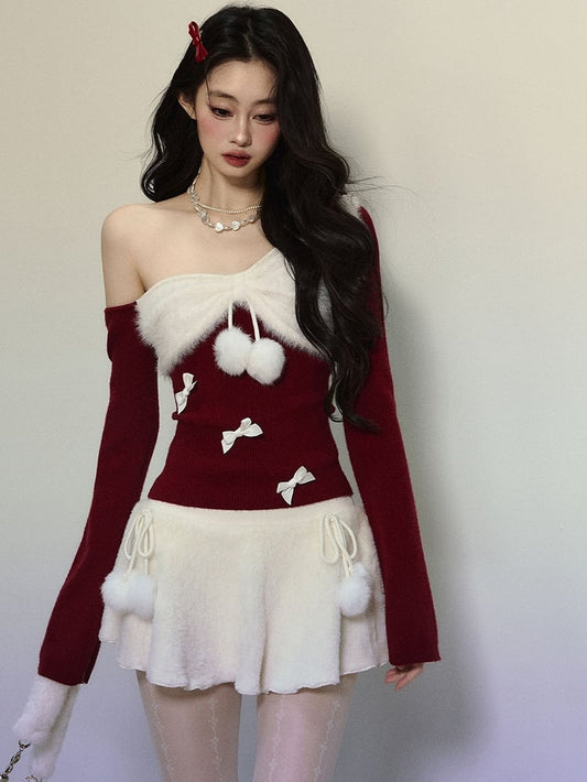 Strickoberteil mit asymmetrischem Ausschnitt und roter Schleife