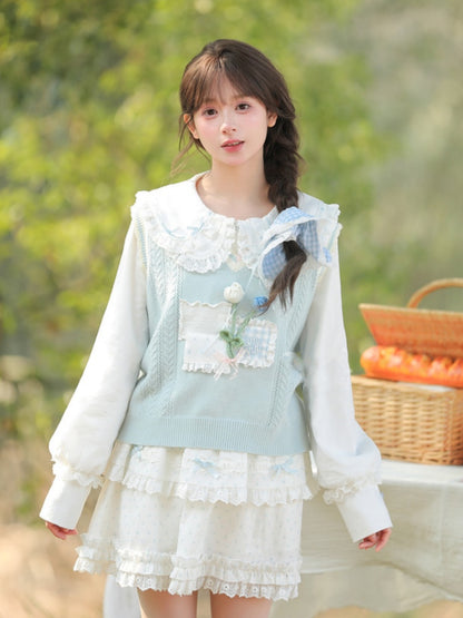 ホワイトレーストリム、ピーターパンカラー、蝶結びディテールのブラウス