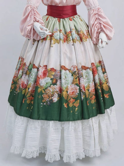 Pinke Poet-Bluse, grüner Rock mit Kristallquaste und Blumenmuster