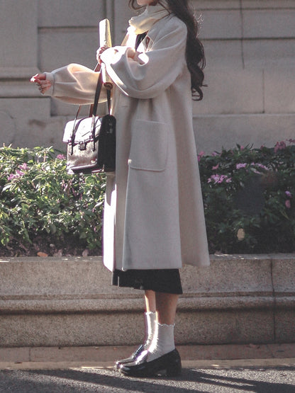 Zweireihiger Reverskragen mit langem Wollmantel in Weiß