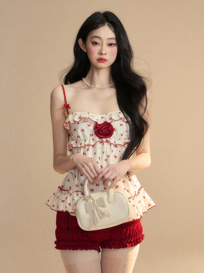 Aprikosenfarbenes Camisole mit Rüschen und rotem Schleifenmuster