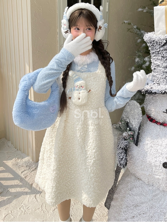 Blaues, langärmliges Oberteil mit Plüschbesatz am Ausschnitt und Schleifendetails