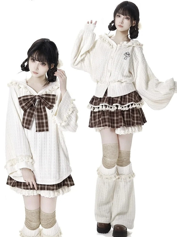 ブラウンのチェック柄ティアードスコート、フリル袖口、フリンジトリム