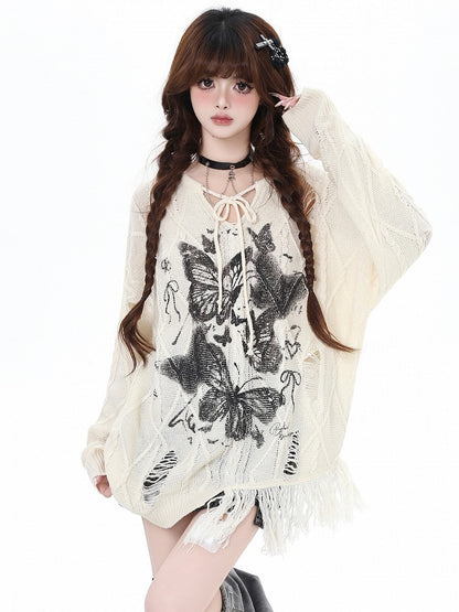 Aprikose/Schwarzes lockeres Strickoberteil mit Schmetterlingsmuster und Löchern im Used-Look und V-Ausschnitt