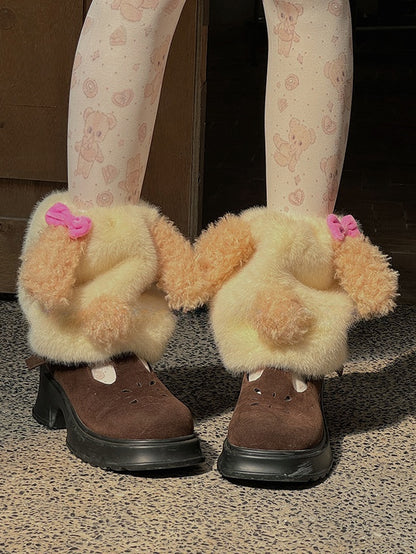 Cremegelbe süße Plüsch-Beinwärmer mit Schleife und Welpenmotiv