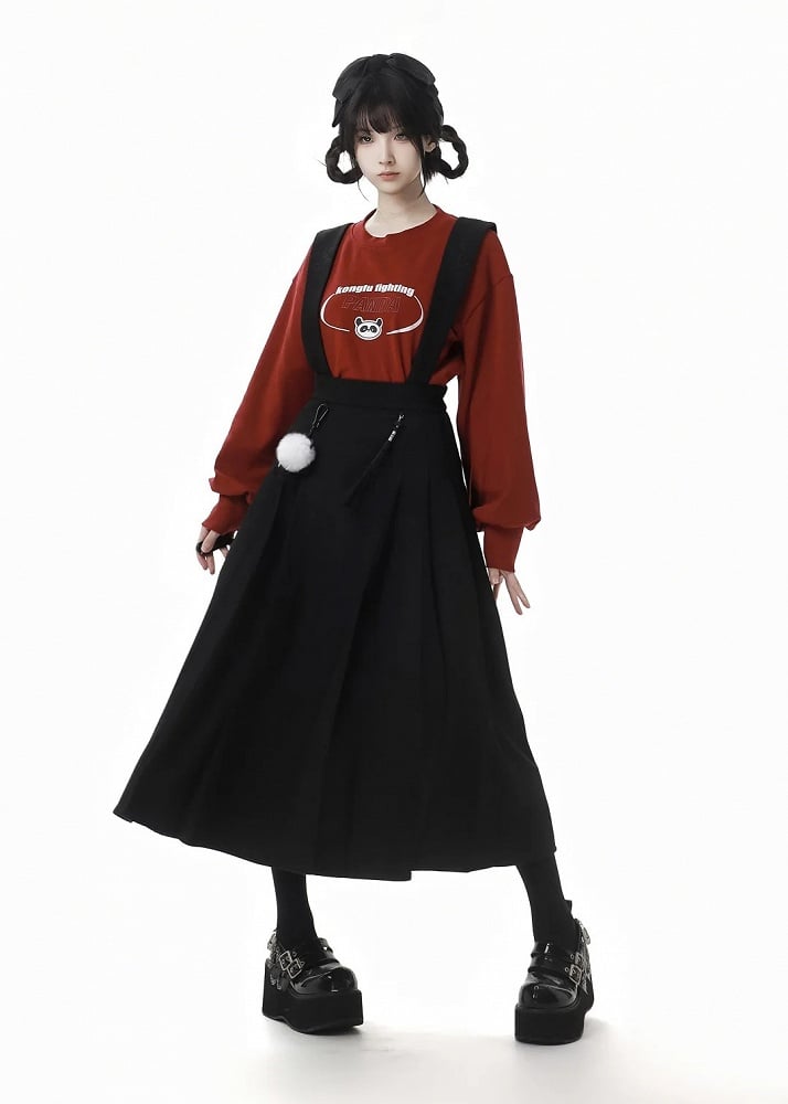 Schwarzer Faltenrock mit abnehmbaren Pompons