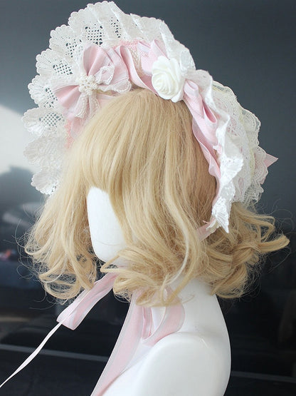 ピンク/ブルーの花柄リボンディテール、レーストリムのボンネット