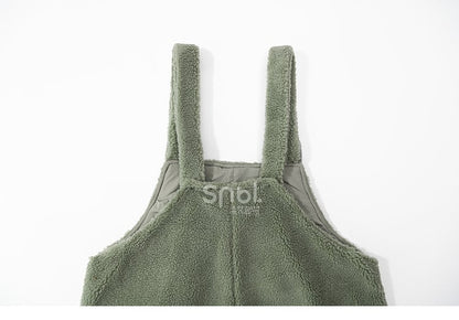 かわいい恐竜の緑のぬいぐるみオーバーオール