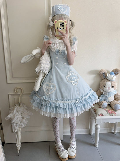 Blaues Lolita-Kleid mit Rüschensaum und Lagenmuster und Polka-Dot-Muster