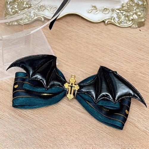 ハロウィンの装飾された蝶結びのコウモリ、黒、赤/緑の羽のヘアクリップ