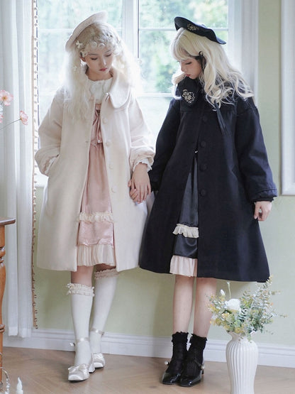 ブラックの繊細な花柄ラウンドフラットカラーウールコート