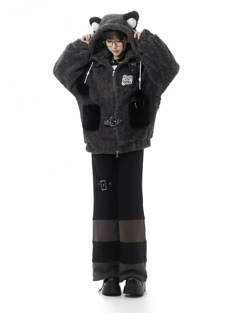 Full-length front view of gray raccoon-ear coat styled with dark trousers