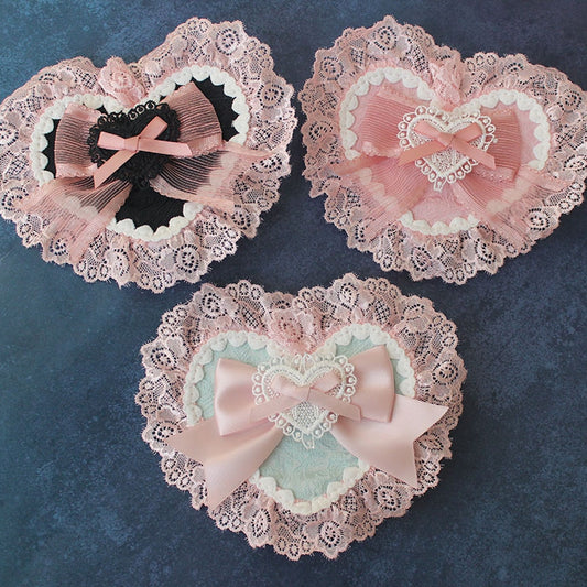 Rosa Haarspange in Herzform mit Schleife und Spitzenbesatz