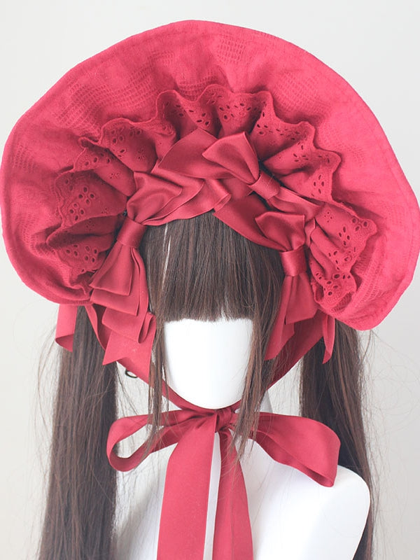 コットンの蝶結びディテール、レーストリムのボンネット