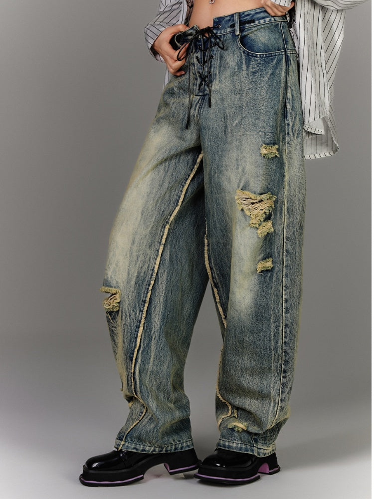 Blaue Vintage-Jeans mit tiefem Bein und Schnürung in der Taille, verblasste Waschung, Distressed-Löcher