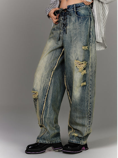 Blaue Vintage-Jeans mit tiefem Bein und Schnürung in der Taille, verblasste Waschung, Distressed-Löcher