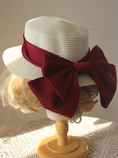 Strohhut mit großer Schleife