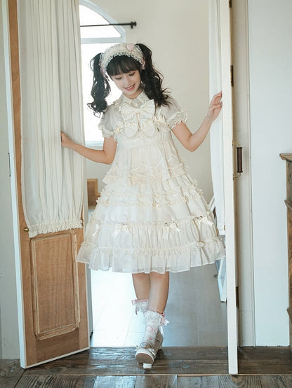 Beiges süßes Lolita-Kleid mit Schleifenakzenten und Rüschenbesatz