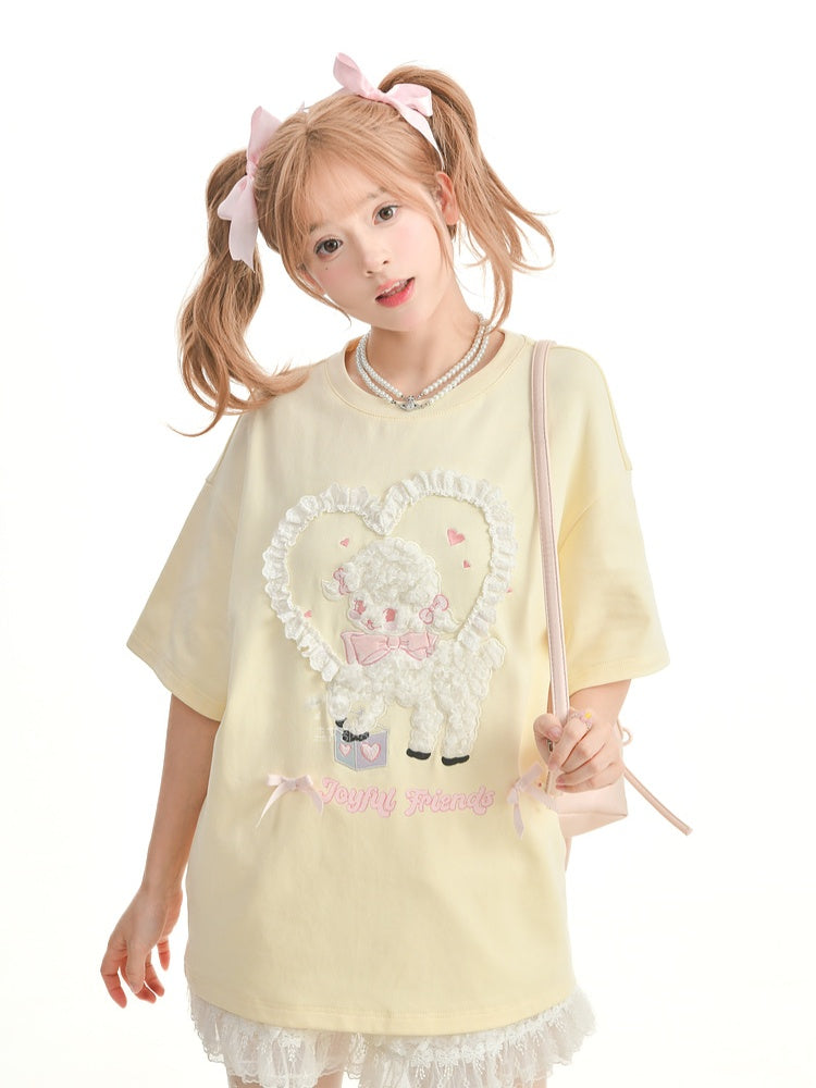 イエローのプラッシュラムアップリケフリルハートルーズTシャツクリーミー