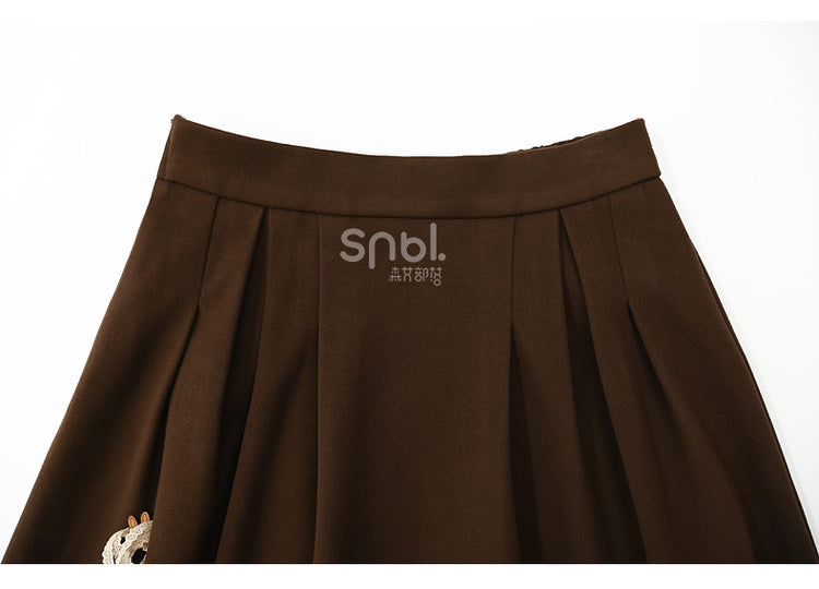 ブラウンの蝶結びディテール、足首丈スカート、チェック柄、フリル裾