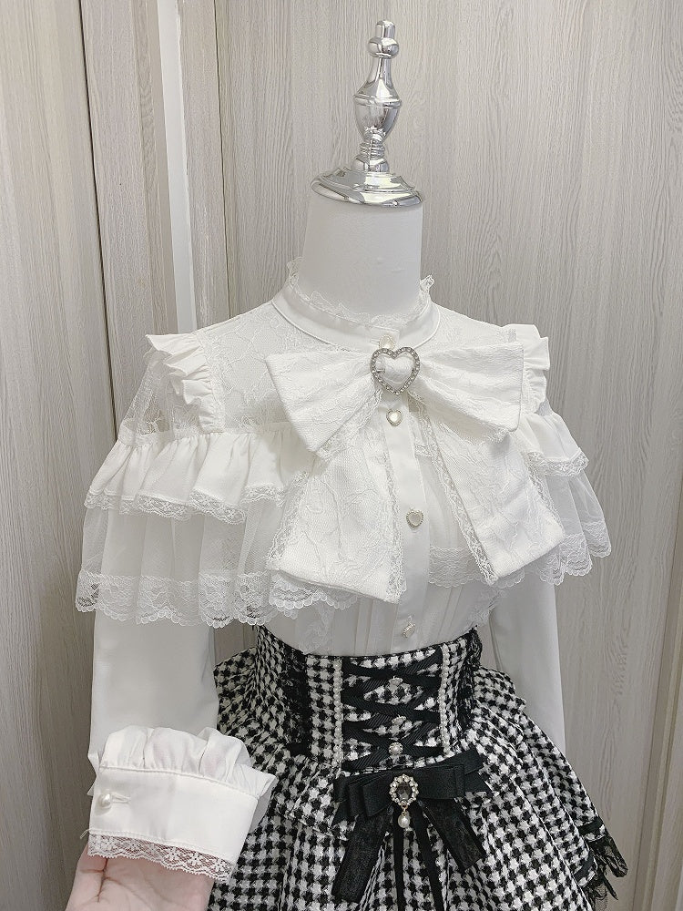 ジライケイのハートボタン付きフリルブラウス、リボン付きビッグスリーブ、ブラック/ホワイトのイリュージョンネックライン、ティアードロング