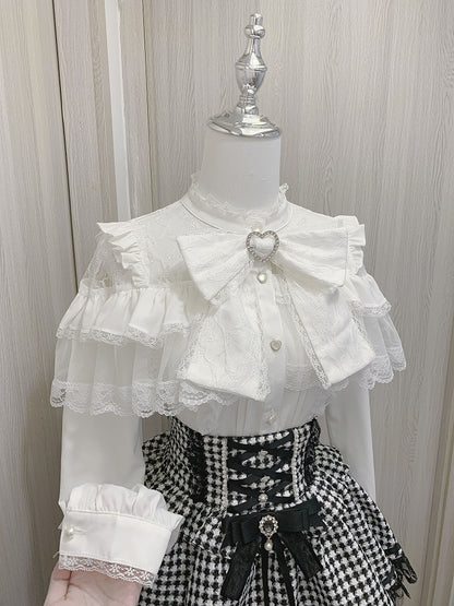 ジライケイのハートボタン付きフリルブラウス、リボン付きビッグスリーブ、ブラック/ホワイトのイリュージョンネックライン、ティアードロング