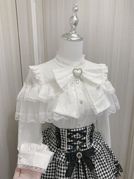 ジライケイのハートボタン付きフリルブラウス、リボン付きビッグスリーブ、ブラック/ホワイトのイリュージョンネックライン、ティアードロング