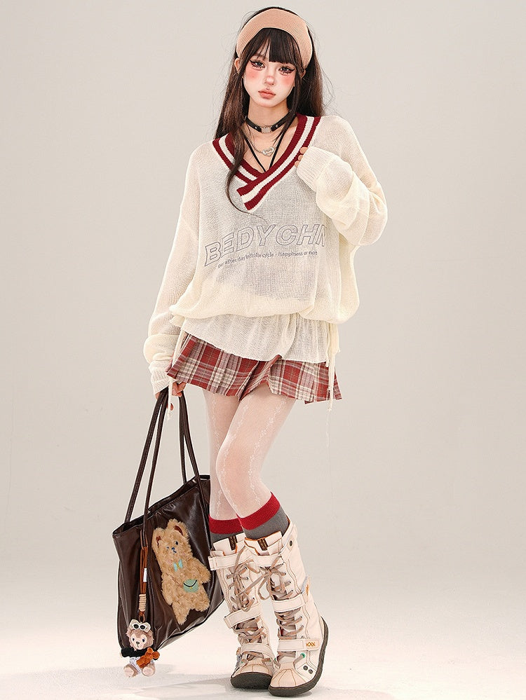 Aprikosenfarbenes, halbtransparentes, lockeres Strickoberteil mit V-Ausschnitt und gerüschter Taille