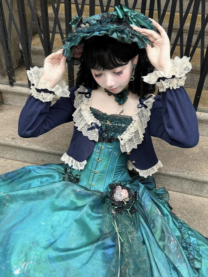 Kurzer, modischer dunkler Cardigan mit Schleife und blauer Spitze