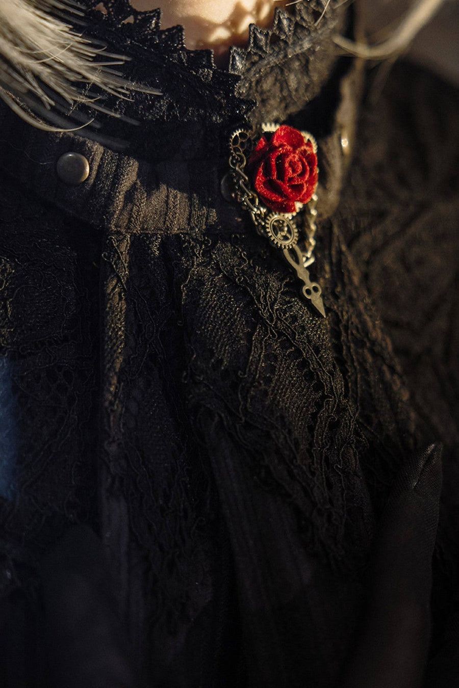 Rose brooch worn on a lace collar