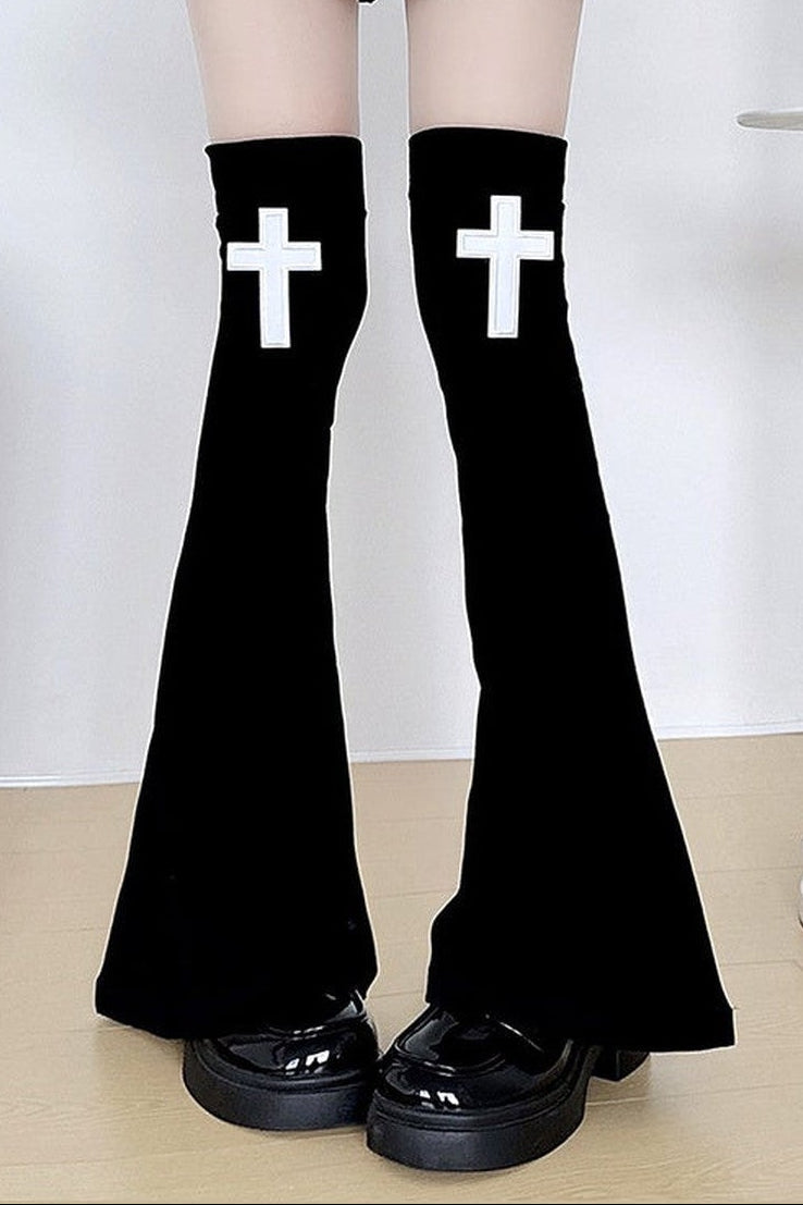 Black flared leg warmers with white crosses
