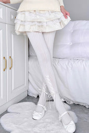 White tights with white ribbon lacing
