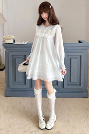 Blue lace dress shown standing