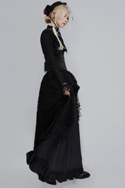 Black hat with veil and dark dress