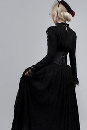 Rear view of black hat and decorative cord