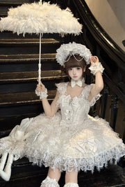 White ruffled dress seated with umbrella