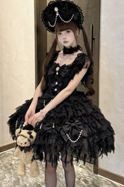 Black lace jumper dress shown seated