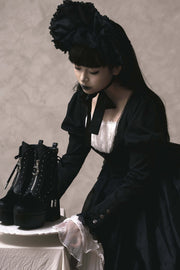 Black boots with lace-up side details