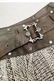 Brown skirt waist hardware close-up