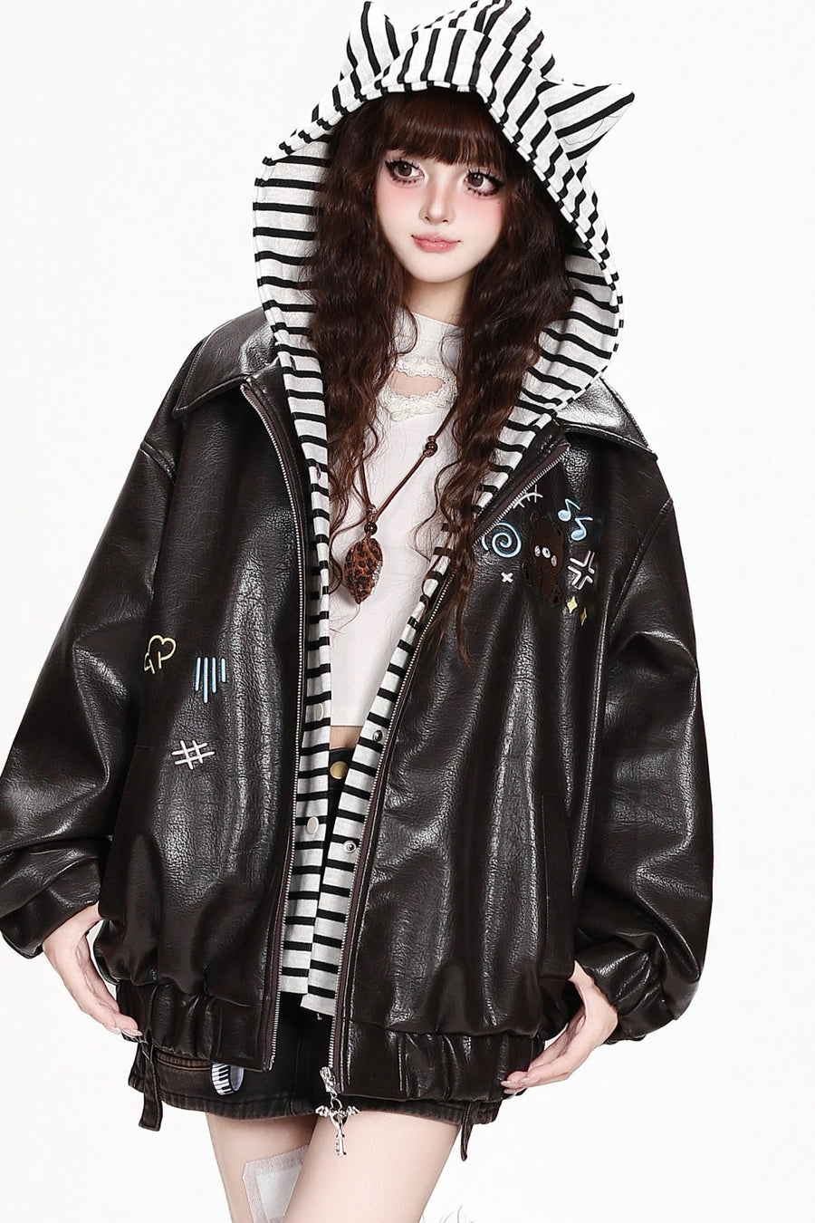 Deep brown faux-leather jacket with striped cat-ear hood