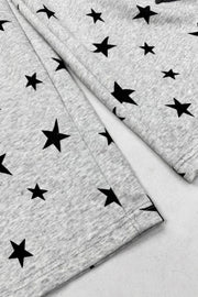 Small black stars on gray fabric