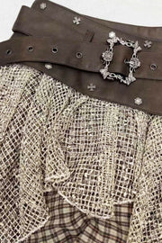 Decorative buckle at brown skirt waist