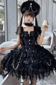 Black layered lace jumper dress seated styling