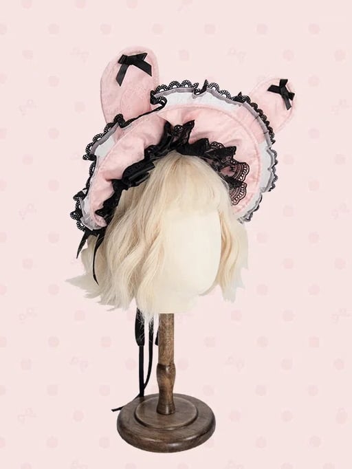 ピンクと白/黒のボンネット耳のウサギ