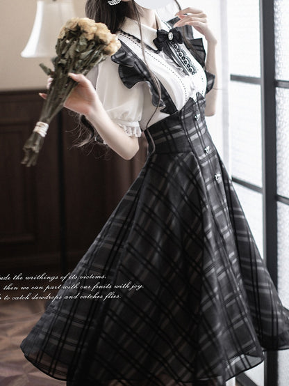 Baskisch mit Jirai-Overallkleid in Kei-Schwarz mit Karomuster, lange Taille, Version mit umgedrehten Flatterärmeln