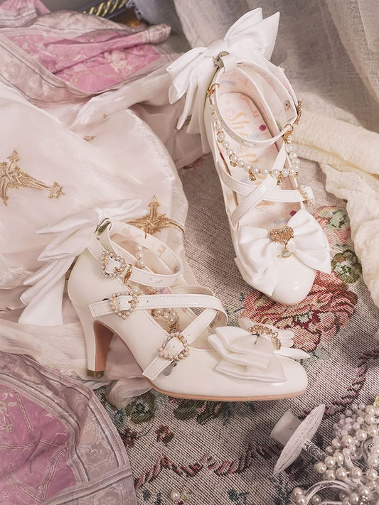 デザイン：ハートにクロスビーズ、トップチャーム、ホワイトリボン